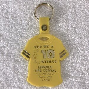 5/$35 Vintage Lepages Tire Corral Yellow T Shirt Keychain Collectible